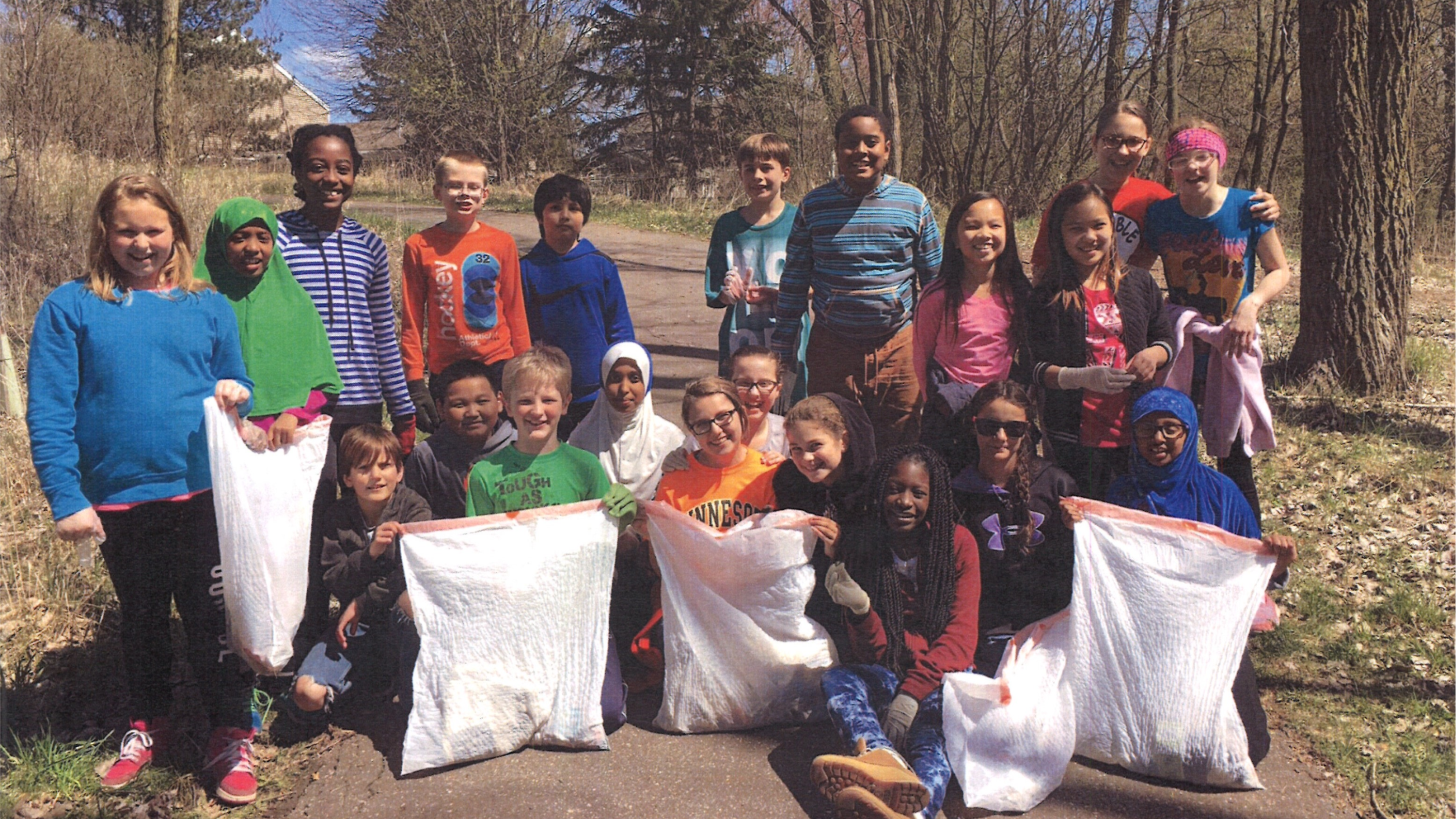 School Group Collecting Trash in a Park