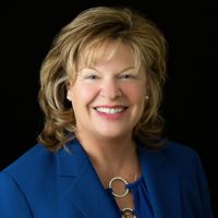 Headshot of Christina Volkers on black background