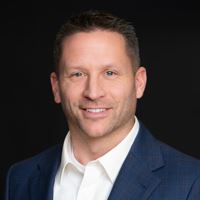 Headshot of person on black background