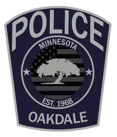 Navy patch with gray text "POLICE" on top with gray tree with text "MINNESOTA EST. 1968 OAK